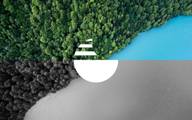 overhead view of land and water with modern circle logo